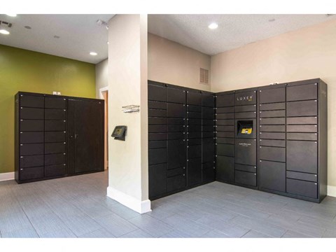 a large set of lockers in a room with a door