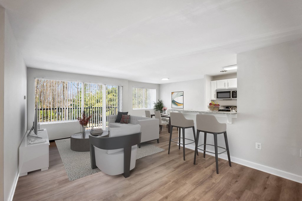 an open living room with a kitchen and a dining room at Roosevelt Towers, Falls Church, VA