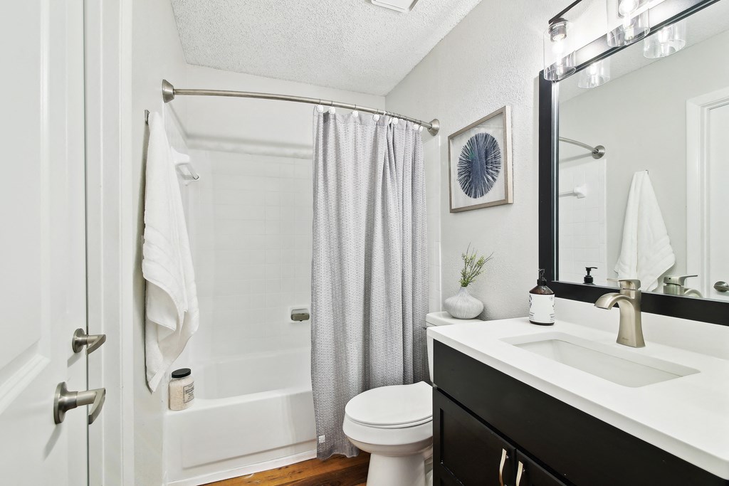 Elme Druid Hills Renovated bathroom with updated vanity and shower at Elme Druid Hills, Atlanta, Georgia