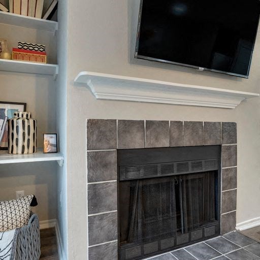 a fireplace with a tv above it in a living room at Elme Alexandria, Alexandria, 22304