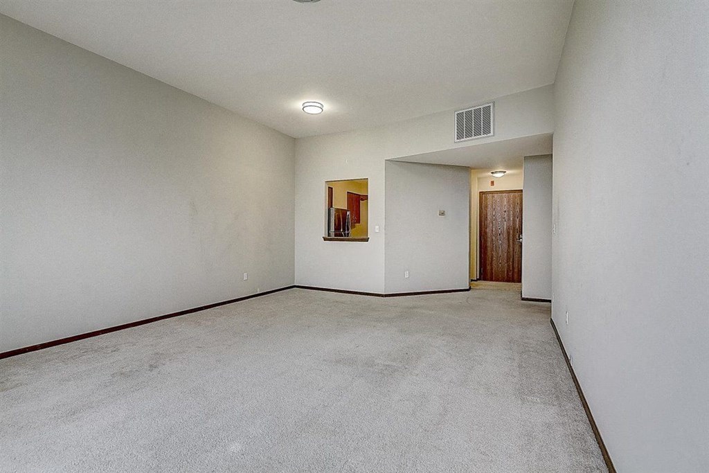 the spacious living room is clean and ready for you to use