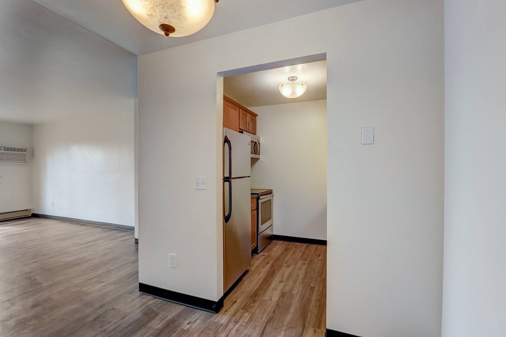a kitchen and living room in a 555 waverly unit