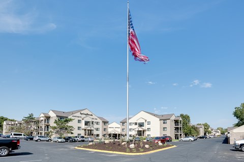 A large building with a flag on top of a pole.