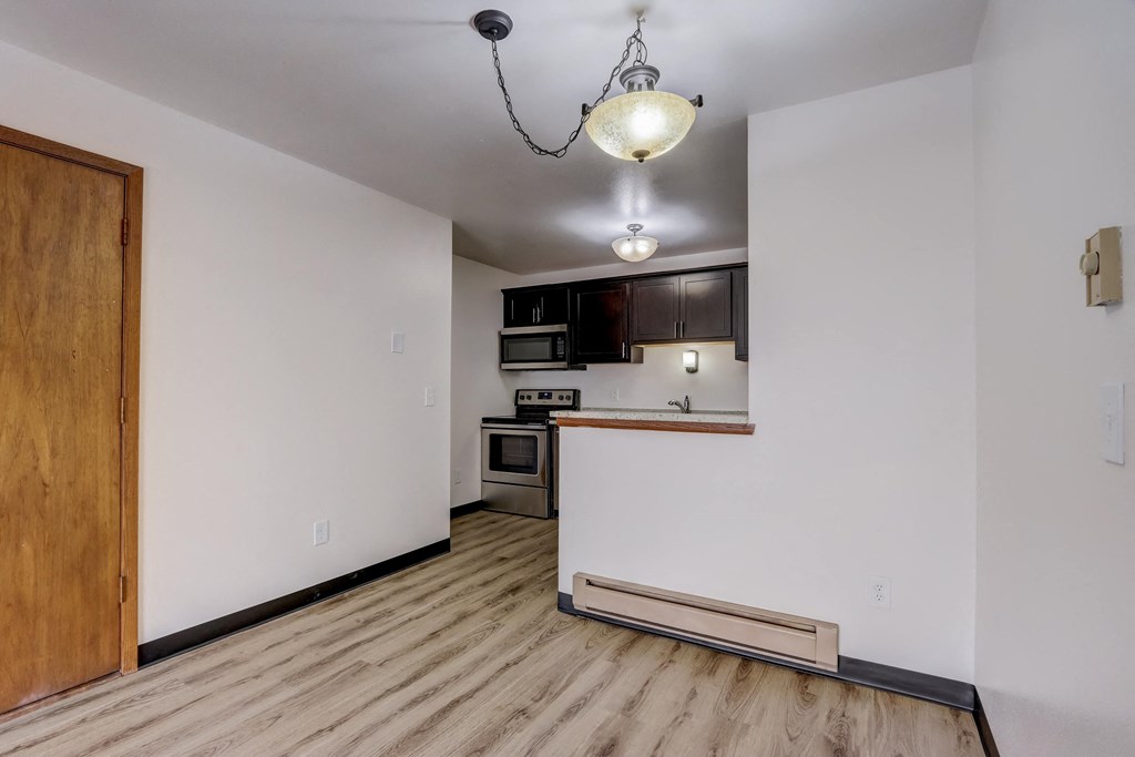 a kitchen and living room in a 555 waverly unit