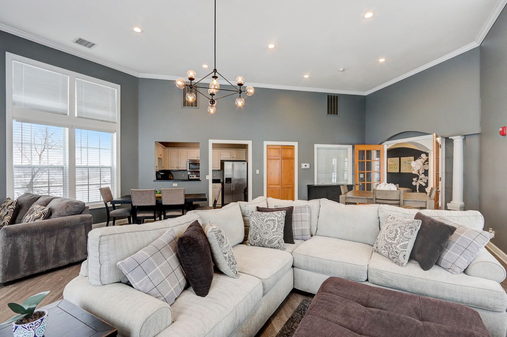 a living room with a large couch and a table