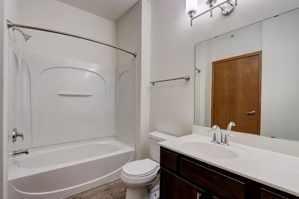 a bathroom with a sink toilet and a tub