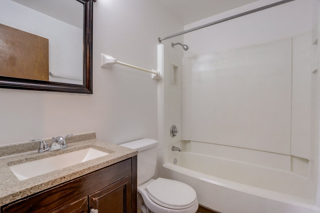 a bathroom with a sink toilet and bathtub