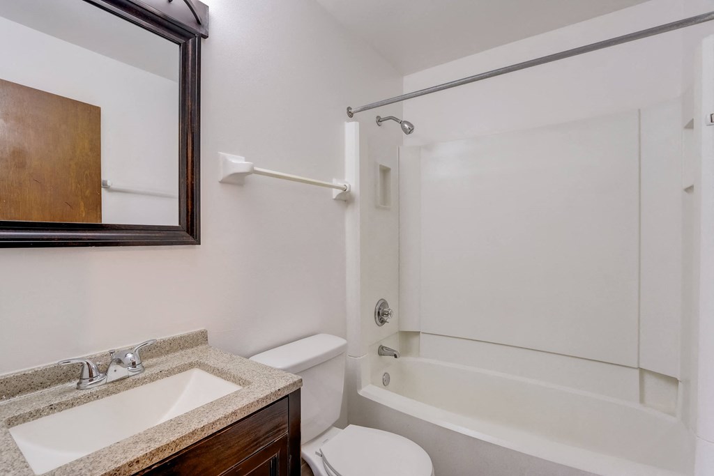 a bathroom with a sink toilet and bathtub