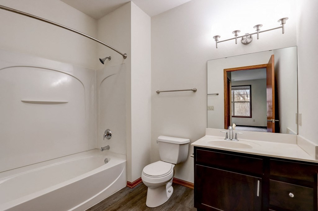 a bathroom with a sink toilet and a bath tub