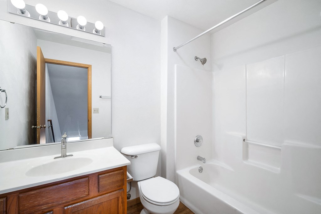 a bathroom with a sink toilet and a bath tub