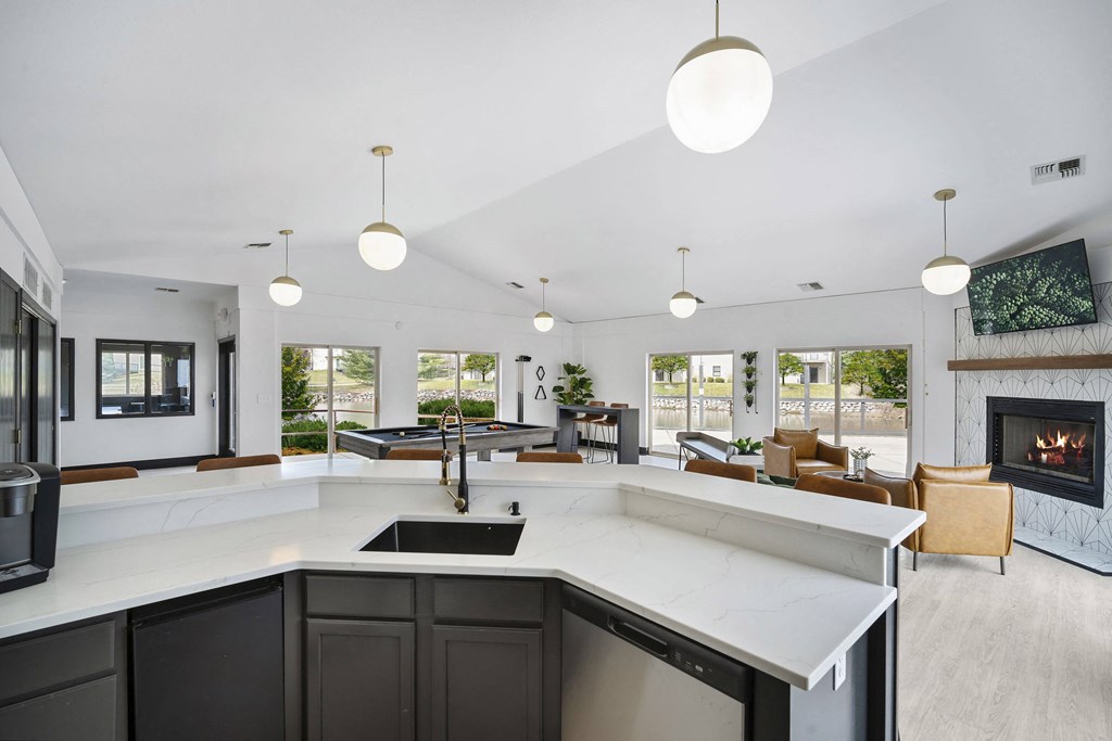 the kitchen is open to the living room and dining room