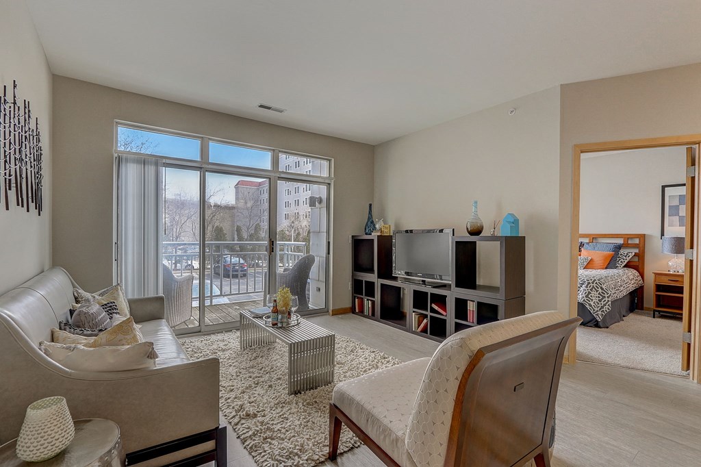 a living room with a couch a chair and a television