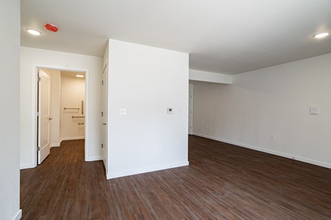 an empty room with a wall of multicolored lights