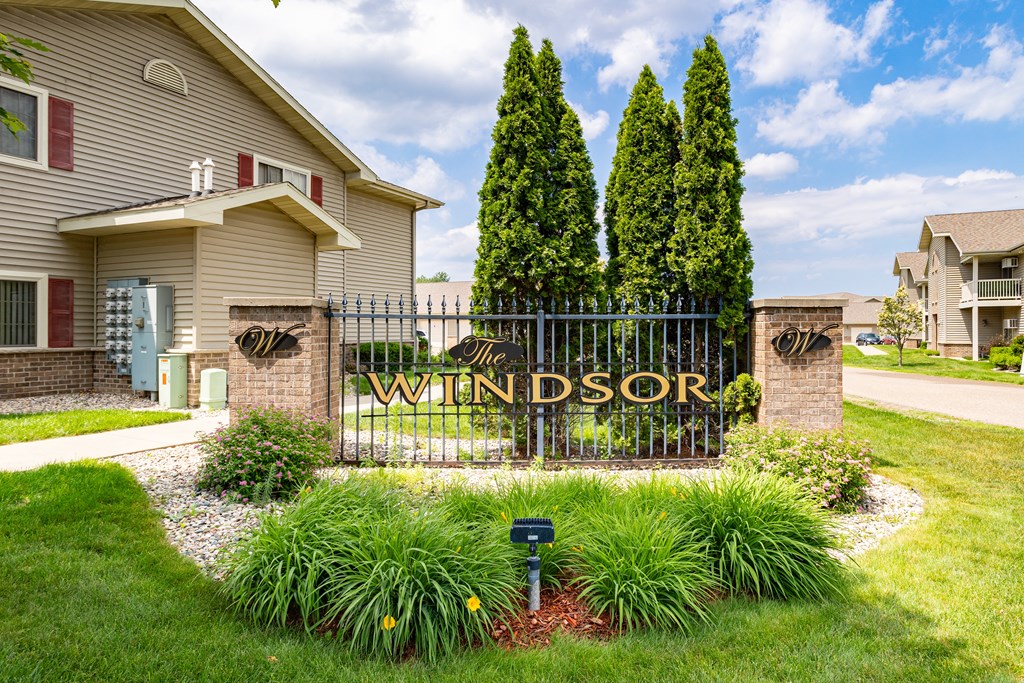 a home with a wrought iron gate that has the word winston on it
