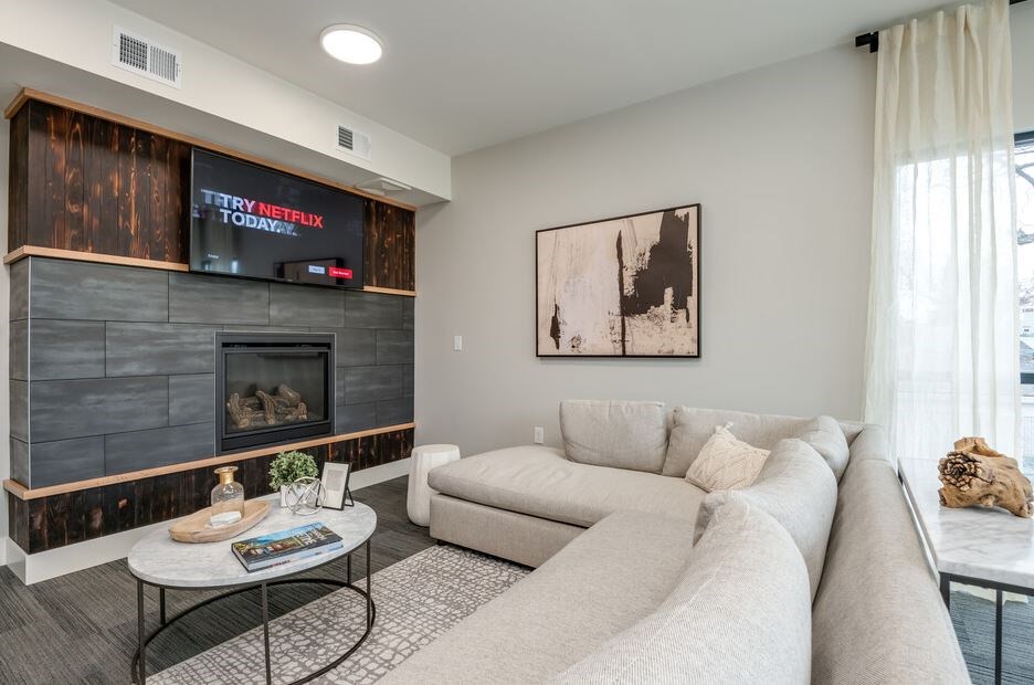 A living room with a fireplace and a couch.