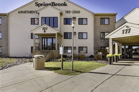 SpringBrook Apartment building with the number 101 on the front.