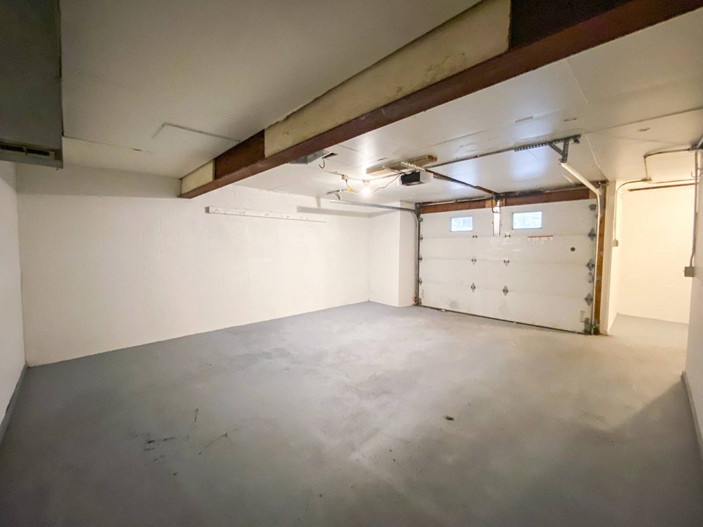 the inside of a garage with a white door