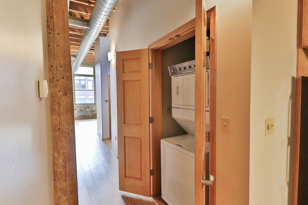 a laundry room with a washer and dryer in a house