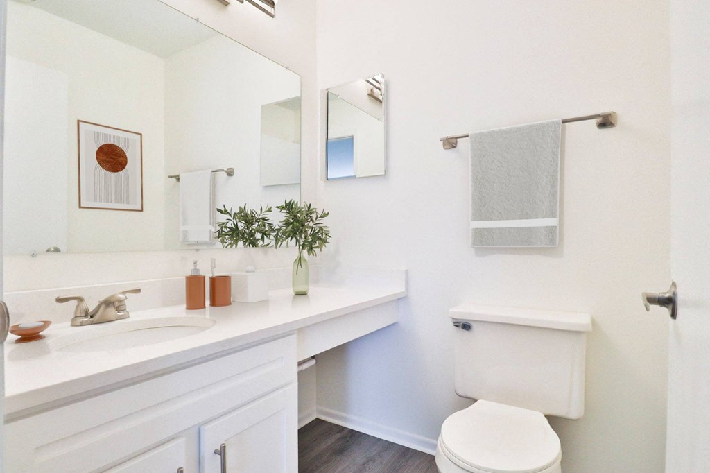 A white bathroom with a toilet and a sink.