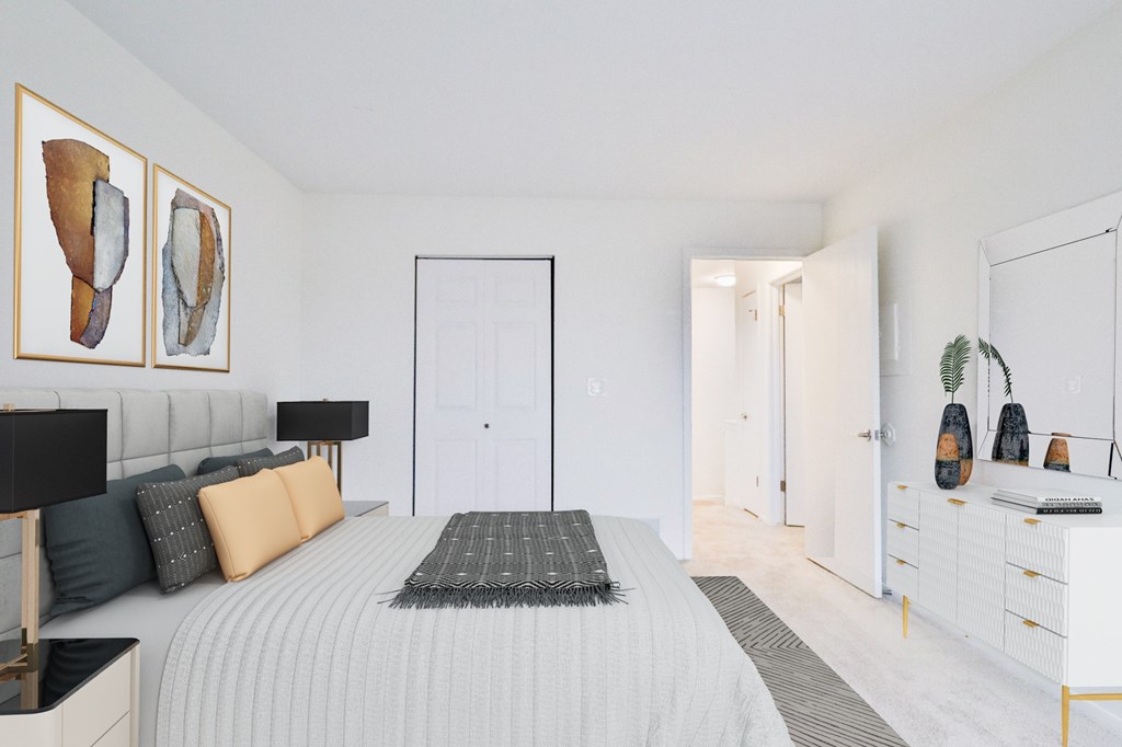 A bedroom with a bed, nightstands, and a dresser.