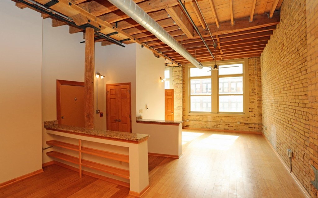 a large room with a counter and a window