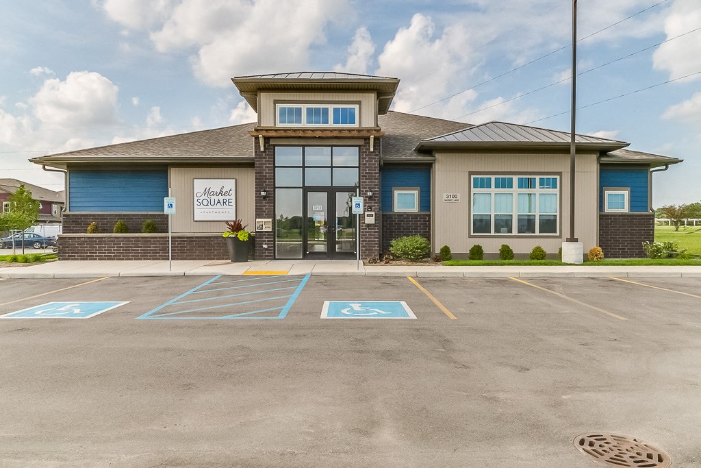 a building with a parking lot in front of it