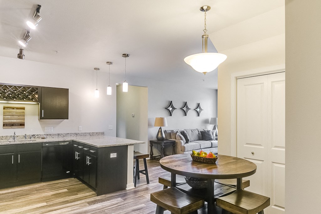 a kitchen and dining area in a 555 waverly unit