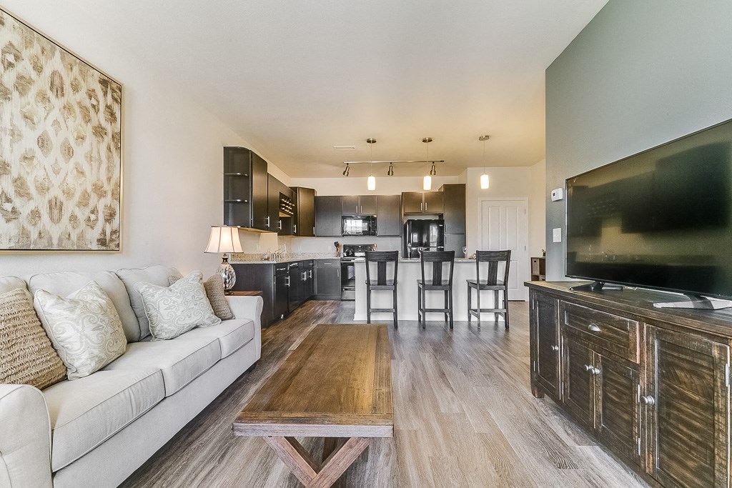 a living room with a couch a table and a tv