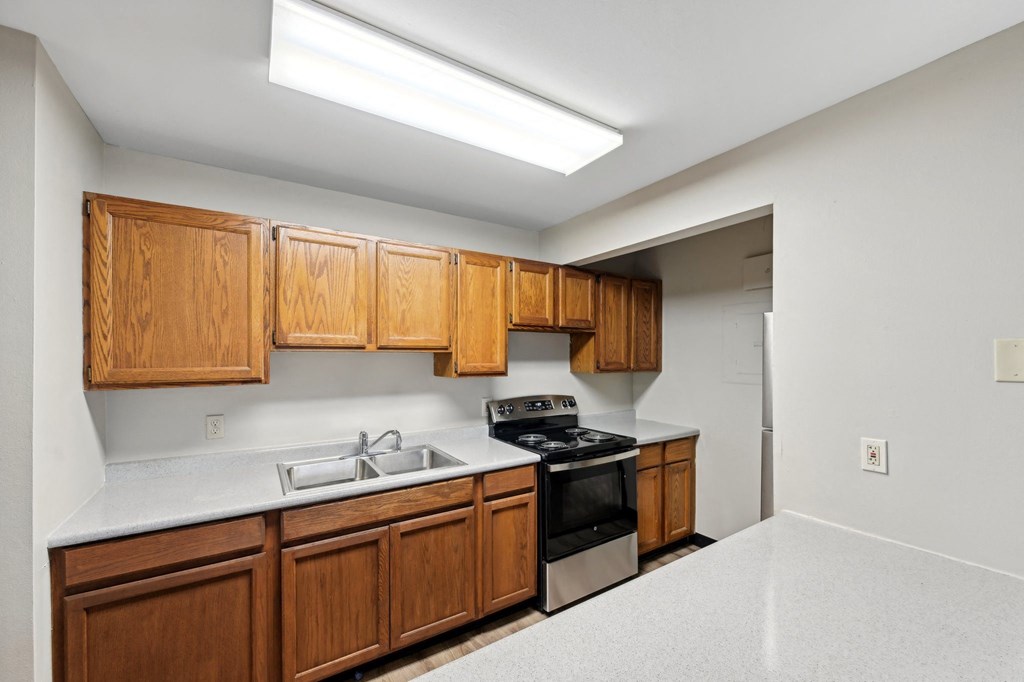 the preserve at ballantyne commons clubhouse kitchen with stove and sink