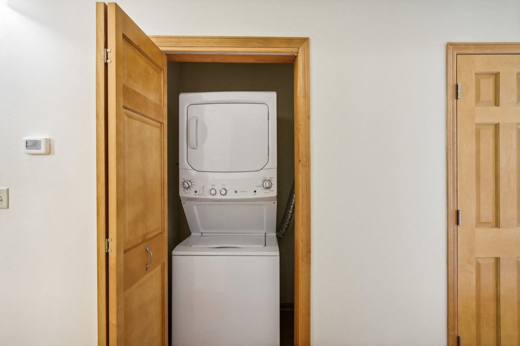 a small laundry room with a washer and dryer
