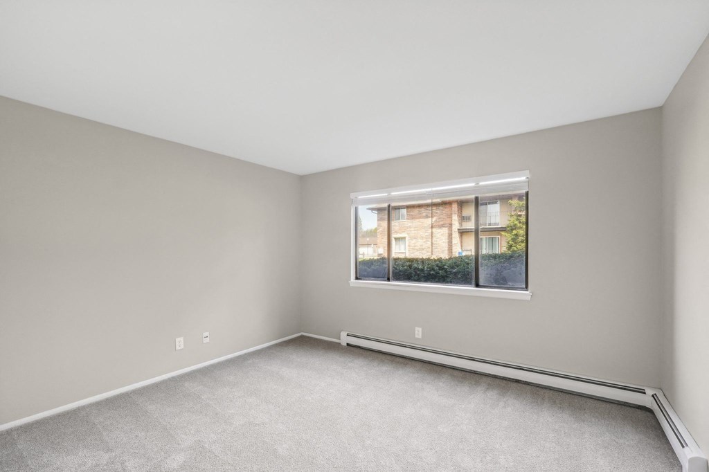 an empty room with a window in it