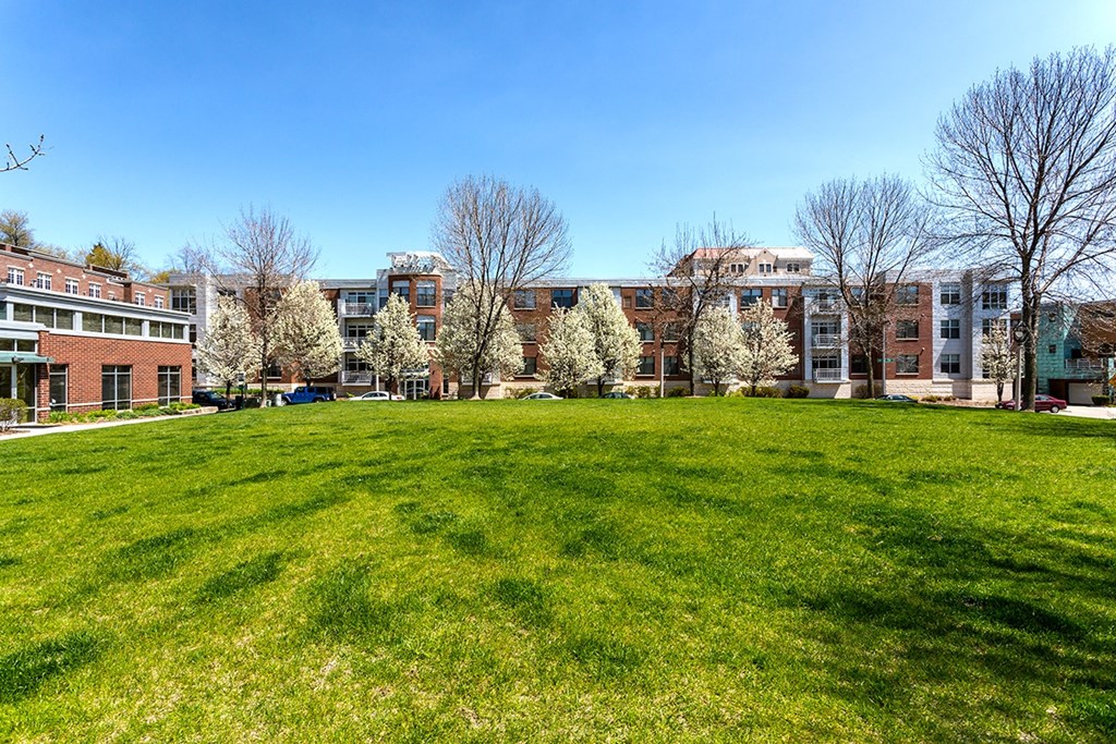 a green lawn in front of a building