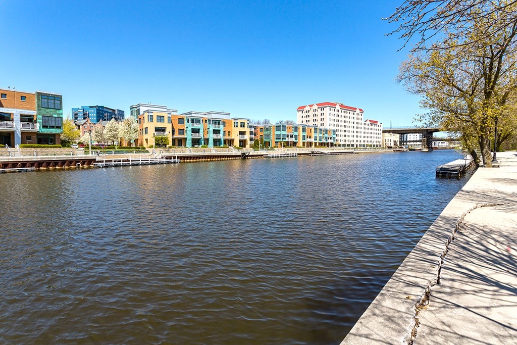 a body of water with buildings on the side of it