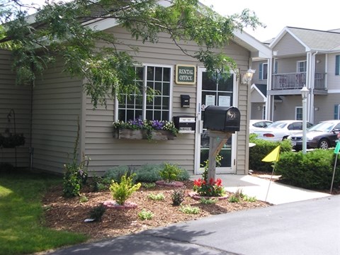 A rental office is located on the ground floor of a two-story building.