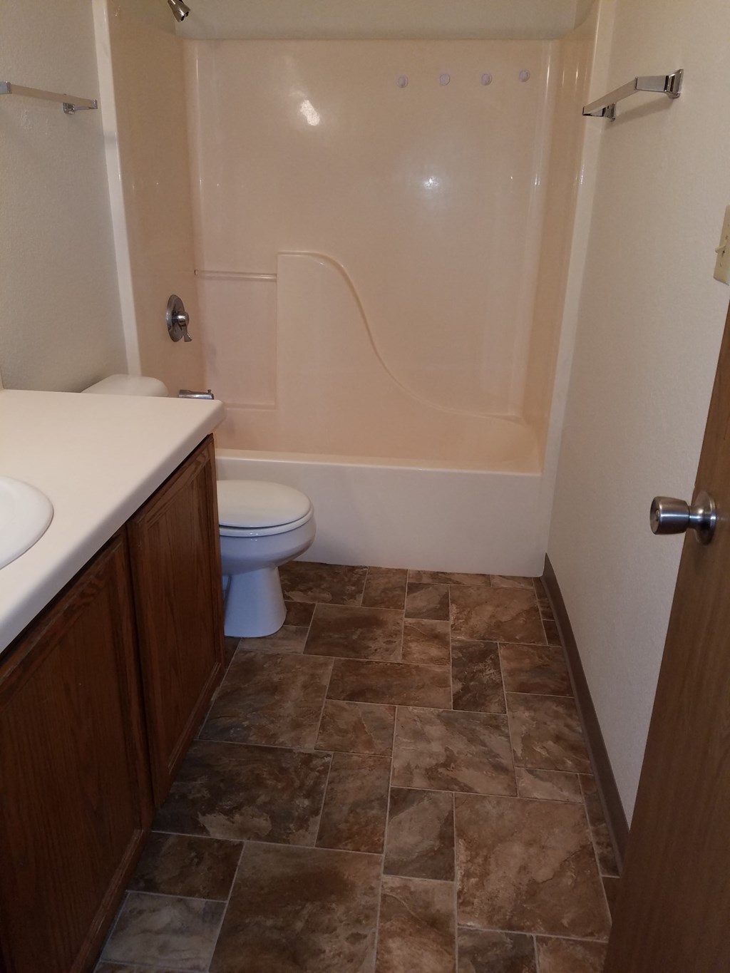 a small bathroom with a toilet sink and bathtub