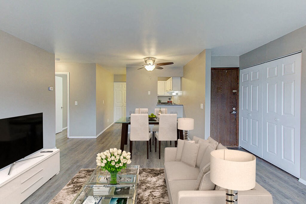 a living room and dining room with a couch and a table