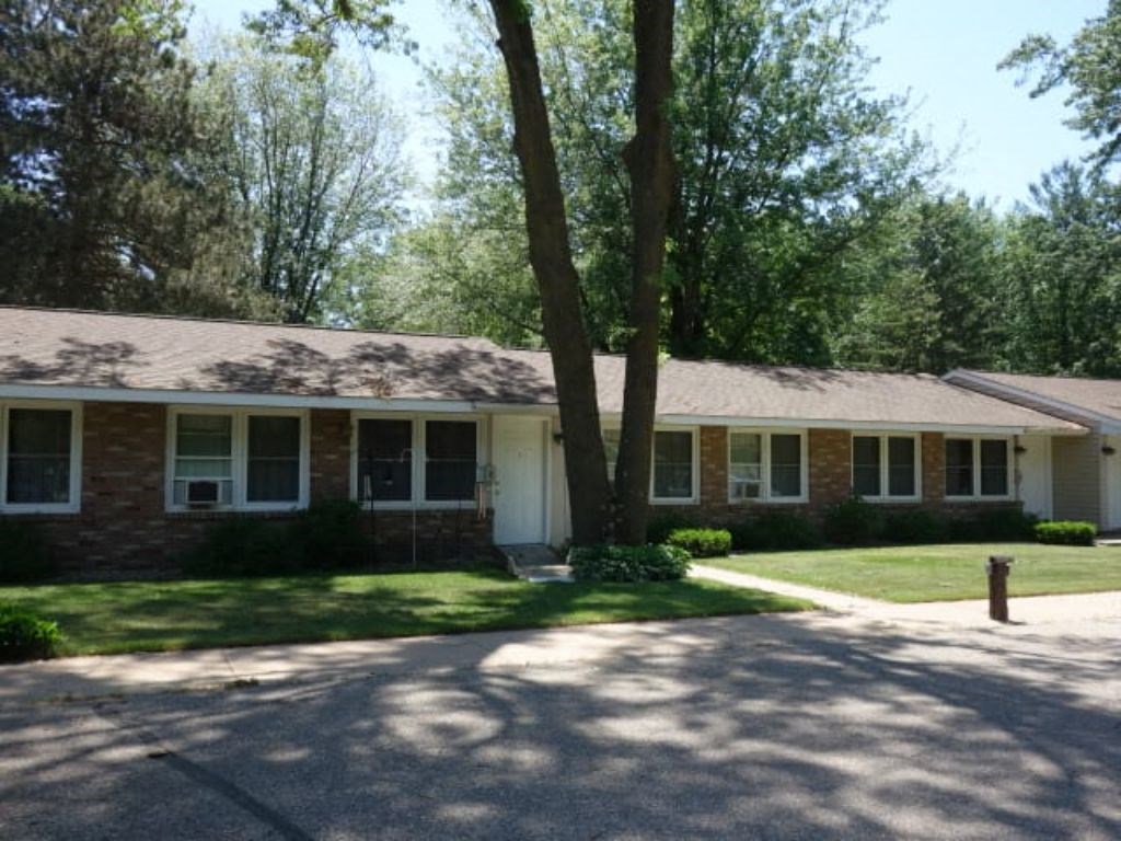 a house with a tree in front of it