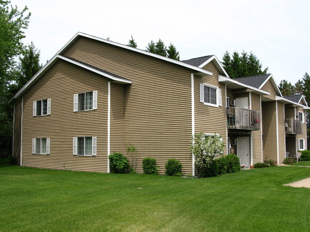 a large house with a yard in front of it