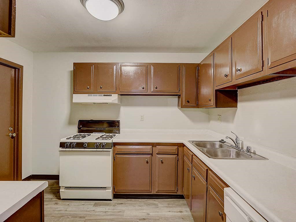 a kitchen with a stove and a sink