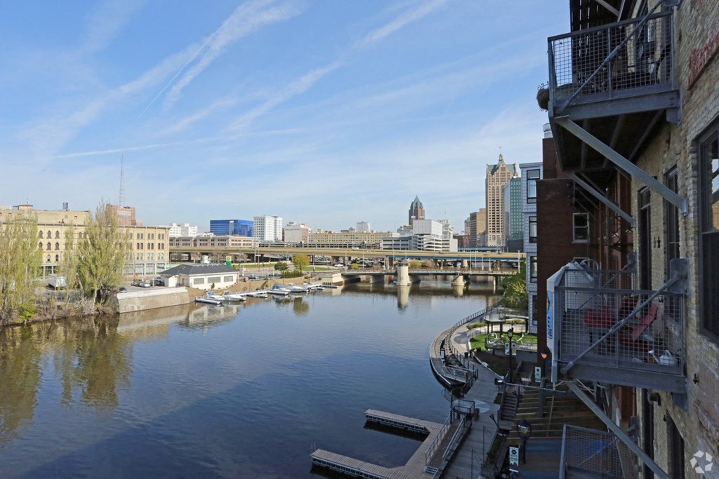 a view of a river with a city in the background