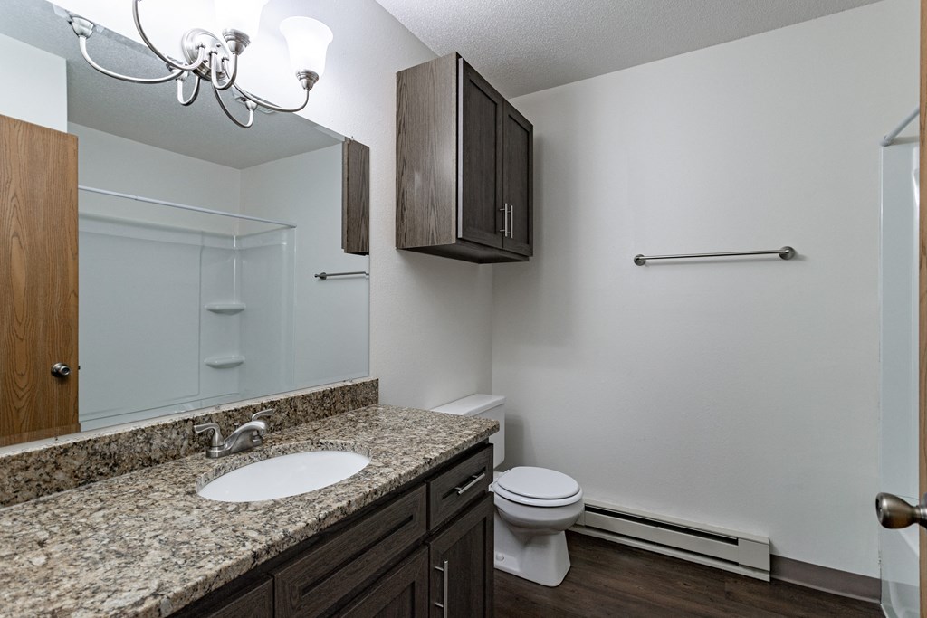 an empty bathroom with a sink and a toilet