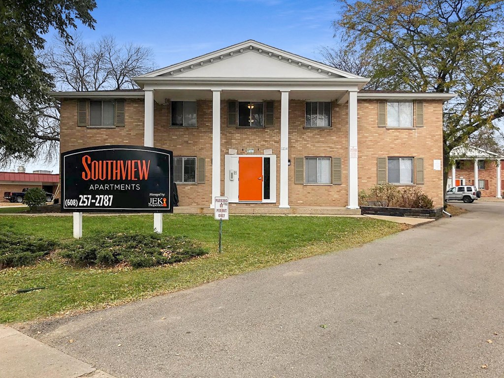 a house with a sign in front of it