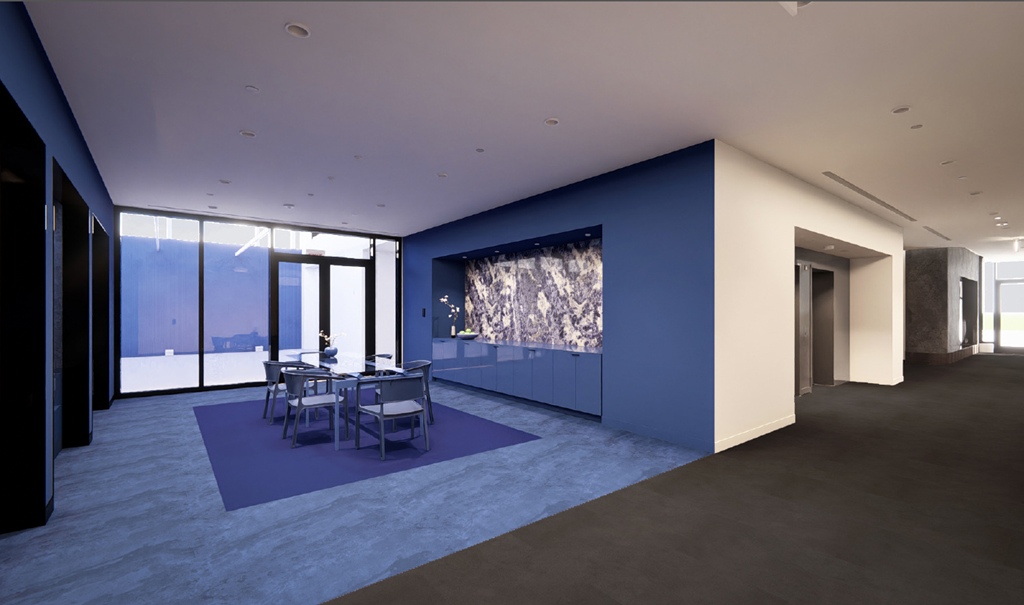 a dining room with a blue wall and a table and chairs at Miles at Ybor, Tampa, FL