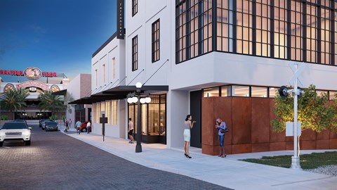 a rendering of the exterior of a building with people on the sidewalk at Miles at Ybor, Tampa, FL