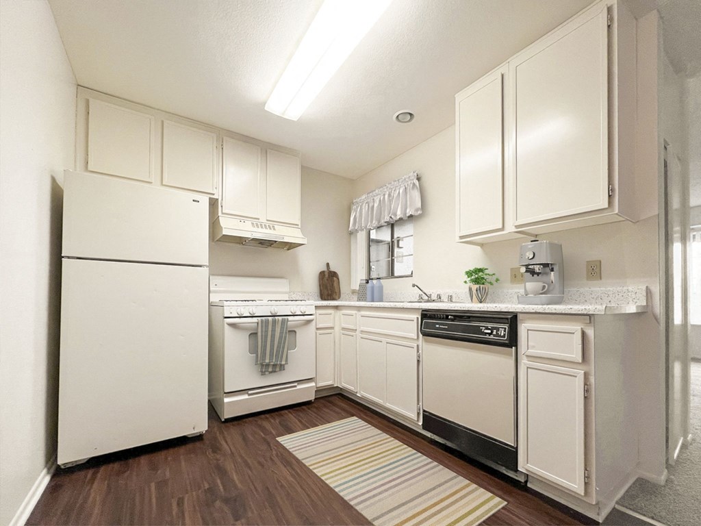 kitchen with white cabinets and appliances at Azul Apartments, Hemet, CA, 92545