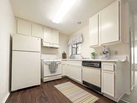 the preserve at ballantyne commons apartment kitchen with white cabinets and appliances