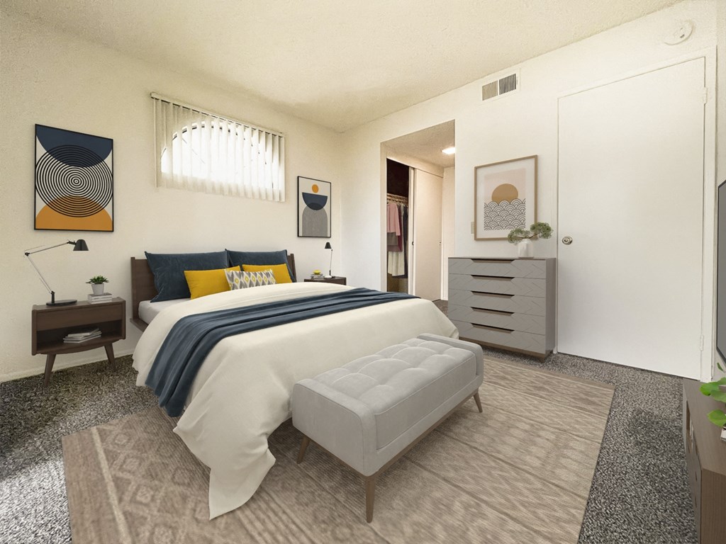 a bedroom with a bed and a white closet