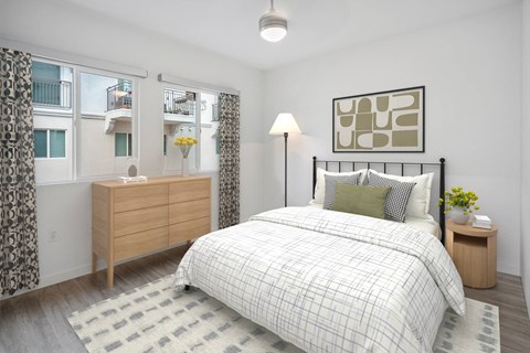 Bright bedroom with dual windows and natural light at Haven at La Mesa Apartments, La Mesa, CA