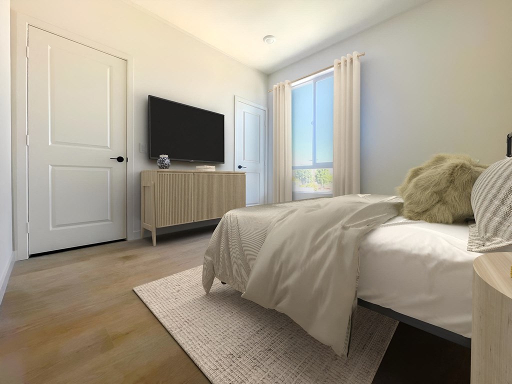 a bedroom with a bed and a tv at The Willow Townhomes, Ontario, 91762