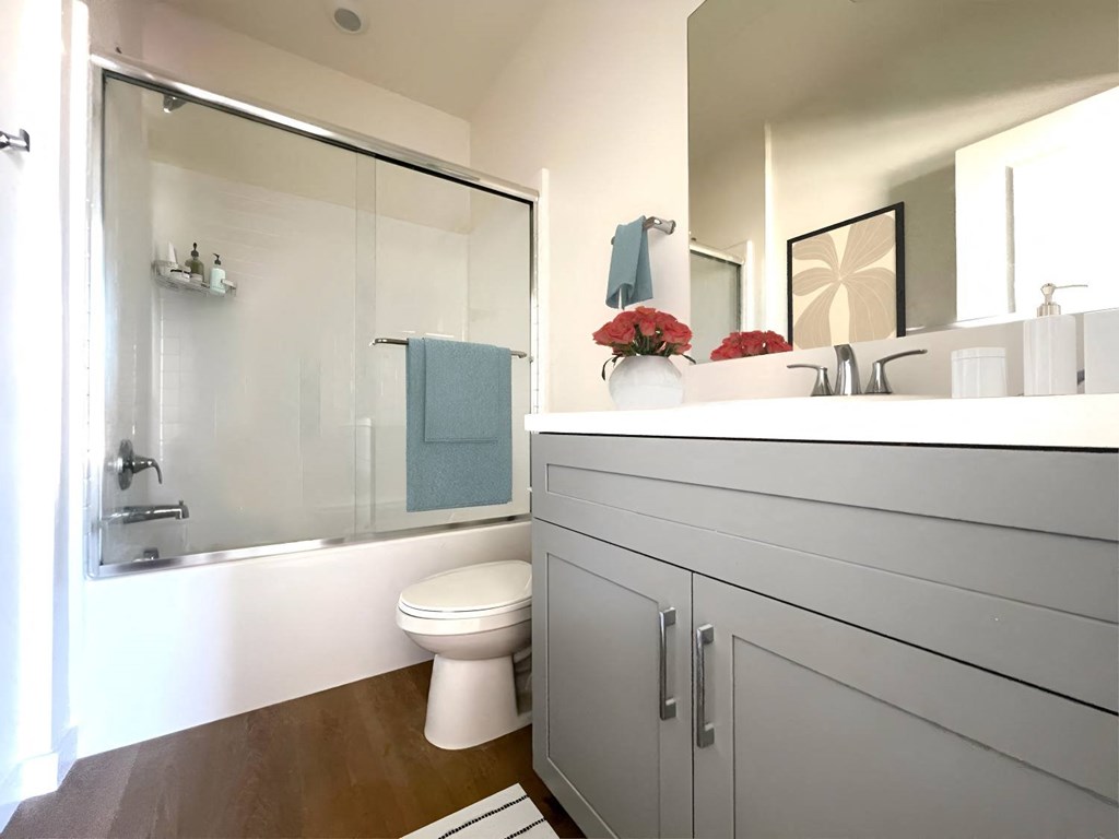 a bathroom with a sink and a toilet and a shower at The Willow Townhomes, CA 91762